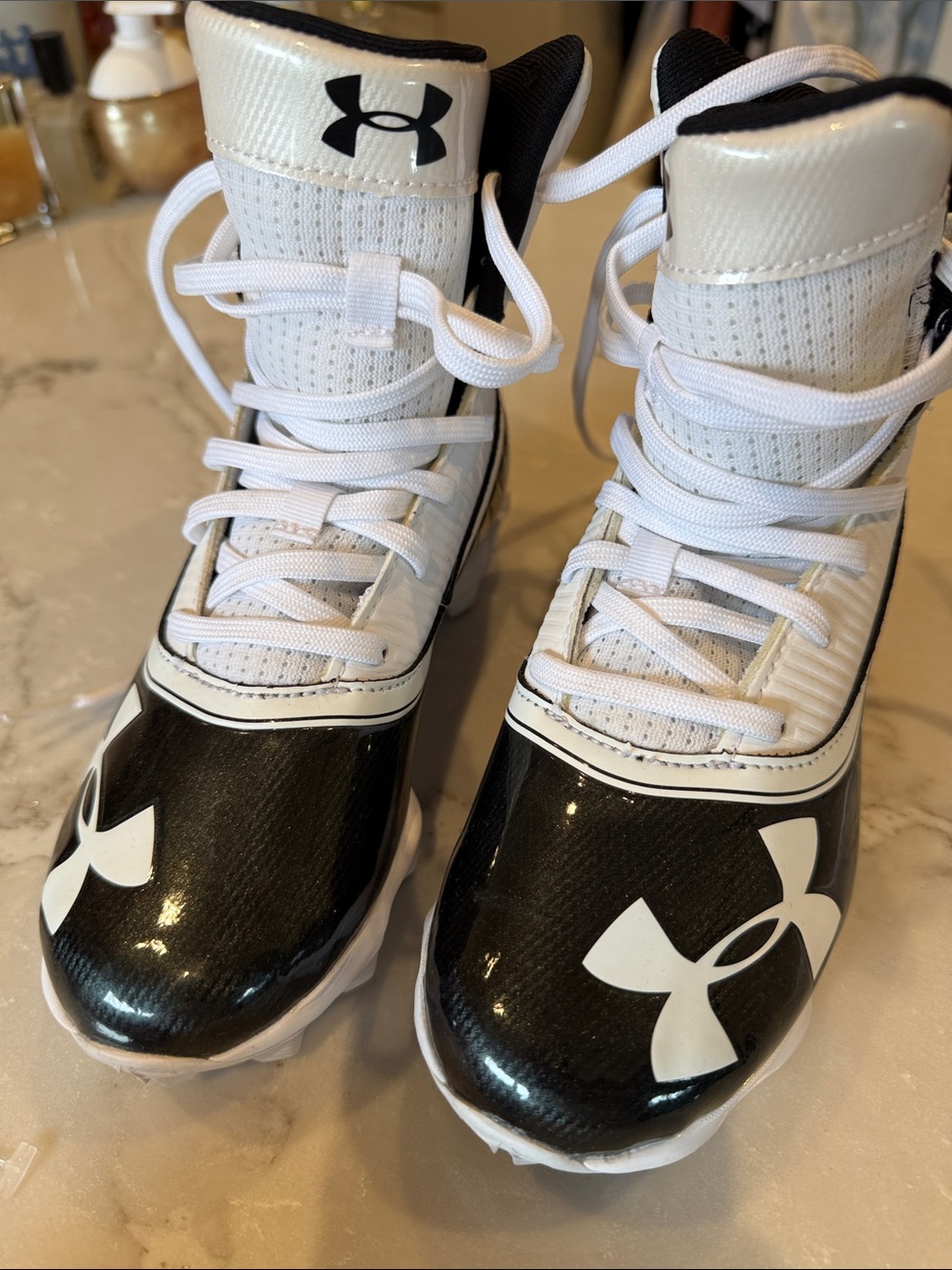 Under Armour Kids Black and White High-Top Sports Cleats ( flag football)